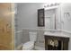 Renovated bathroom with a glass-enclosed shower and a single sink vanity at 695 Old Peachtree Rd, Lawrenceville, GA 30043