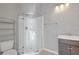 Bright bathroom featuring a glass shower and modern vanity at 695 Old Peachtree Rd, Lawrenceville, GA 30043