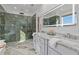 Luxurious bathroom boasting a double vanity, a glass shower, and marble countertops at 695 Old Peachtree Rd, Lawrenceville, GA 30043