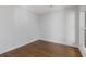 Bedroom with hardwood floors, white walls, and one window at 695 Old Peachtree Rd, Lawrenceville, GA 30043