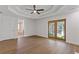 Bright bedroom featuring tray ceilings, french doors to the outside, and neutral paint at 695 Old Peachtree Rd, Lawrenceville, GA 30043