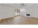 Spacious room with a fireplace and french doors leading to the outside at 695 Old Peachtree Rd, Lawrenceville, GA 30043
