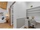 Bedroom with wood floors, desk, chair, shelving, sliding barn door, and a comfortable bed at 695 Old Peachtree Rd, Lawrenceville, GA 30043
