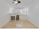 Bonus room featuring built in shelves, travertine floors, and a small staircase at 695 Old Peachtree Rd, Lawrenceville, GA 30043