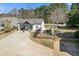 Charming exterior view of the property with a fenced yard and a playground at 695 Old Peachtree Rd, Lawrenceville, GA 30043