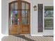 Double front door with decorative hardware and dark-stained wood at 695 Old Peachtree Rd, Lawrenceville, GA 30043