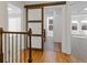 Hallway with a modern sliding barn door that conceals the laundry room at 695 Old Peachtree Rd, Lawrenceville, GA 30043