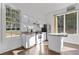 Efficient kitchen with white cabinets, granite countertops, stainless steel appliances, and natural light at 695 Old Peachtree Rd, Lawrenceville, GA 30043