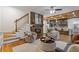 Inviting living room featuring a stone fireplace, hardwood floors, and an open floor plan at 695 Old Peachtree Rd, Lawrenceville, GA 30043