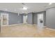 Spacious living room featuring tiled floors, a fireplace, and a view of the backyard at 695 Old Peachtree Rd, Lawrenceville, GA 30043