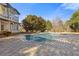 Stunning pool with stone patio and a view of the home's exterior at 695 Old Peachtree Rd, Lawrenceville, GA 30043