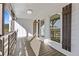 Covered front porch features white vertical siding, dark shutters, and a tongue-and-groove porch floor at 695 Old Peachtree Rd, Lawrenceville, GA 30043