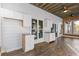 Versatile sunroom with built-in cabinetry, ceiling fan, and lots of light from the sliding glass doors at 695 Old Peachtree Rd, Lawrenceville, GA 30043