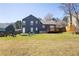Expansive backyard showcasing patio, firepit and ample space for outdoor activities at 710 Josh Ln, Lawrenceville, GA 30045