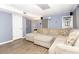 Finished basement featuring a large sectional sofa, a projector for movies, and access to a small bathroom at 710 Josh Ln, Lawrenceville, GA 30045