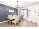 Open dining area with a modern light fixture and a view into the kitchen at 710 Josh Ln, Lawrenceville, GA 30045