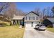 Charming two-story home with a two car garage, a manicured lawn, and a bright blue front door at 710 Josh Ln, Lawrenceville, GA 30045