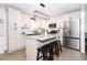 Modern kitchen featuring stainless steel appliances, granite countertops, and a center island at 710 Josh Ln, Lawrenceville, GA 30045