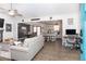 Open-concept living room with hardwood floors, fireplace, and views into the kitchen and dining areas at 710 Josh Ln, Lawrenceville, GA 30045