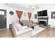 Inviting living room featuring a fireplace, neutral tones, and lots of natural light at 710 Josh Ln, Lawrenceville, GA 30045