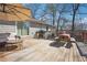 A furnished wooden deck with a grill and patio furniture for relaxing outdoors at 2518 Crestdale Se Cir, Atlanta, GA 30316