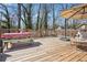 Enjoy outdoor living on this spacious deck with a table setting and ample seating at 2518 Crestdale Se Cir, Atlanta, GA 30316