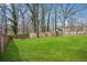Expansive backyard featuring a lush lawn and a wooden fence for privacy at 2518 Crestdale Se Cir, Atlanta, GA 30316