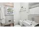 Bright bathroom featuring modern sink, sleek fixtures, and a window bringing in natural light at 2518 Crestdale Se Cir, Atlanta, GA 30316