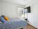 Bedroom with a TV mounted on the wall and a large window for natural light at 2518 Crestdale Se Cir, Atlanta, GA 30316