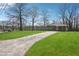 Ranch-style home with a well-kept lawn and a lengthy driveway on a sunny day at 2518 Crestdale Se Cir, Atlanta, GA 30316