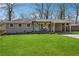 Charming single-story home with a well-manicured lawn and a covered carport at 2518 Crestdale Se Cir, Atlanta, GA 30316