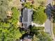 Overhead view of the house, highlighting the roof, backyard, patio, and surrounding trees and greenery at 745 Princeton Mill Run, Marietta, GA 30068