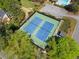 Aerial view showcasing the community tennis courts with lush greenery surrounding the area at 745 Princeton Mill Run, Marietta, GA 30068