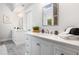 Bright bathroom with white cabinets, quartz counters, and a skylight above the mirror at 745 Princeton Mill Run, Marietta, GA 30068