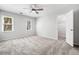 Bedroom with neutral walls, carpet, ceiling fan, and natural light from two windows at 745 Princeton Mill Run, Marietta, GA 30068