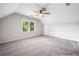 Bright and airy bedroom with neutral decor, a ceiling fan, and a large window at 745 Princeton Mill Run, Marietta, GA 30068