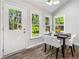 Charming breakfast nook features bright natural light and views of the landscaped yard at 745 Princeton Mill Run, Marietta, GA 30068