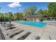 Relax by the community pool with ample seating and shade, ideal for summer days at 745 Princeton Mill Run, Marietta, GA 30068
