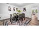 Elegant dining room boasts stylish decor, a contemporary rug, and sunlit windows at 745 Princeton Mill Run, Marietta, GA 30068