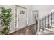 A welcoming foyer with hardwood floors, white trim, and a staircase at 745 Princeton Mill Run, Marietta, GA 30068