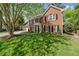 Lovely two-story brick home with a well-kept lawn and a two-car garage at 745 Princeton Mill Run, Marietta, GA 30068