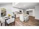 Updated kitchen featuring white cabinets, stainless appliances, a center island, and adjacent dining area at 745 Princeton Mill Run, Marietta, GA 30068