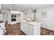 Bright kitchen boasts a center island, stainless appliances, modern finishes, and hard wood floors at 745 Princeton Mill Run, Marietta, GA 30068