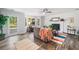 A bright living room features a fireplace, a ceiling fan, and a door to the backyard at 745 Princeton Mill Run, Marietta, GA 30068