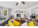 Bright living room with a fireplace, a colorful rug, and large windows at 745 Princeton Mill Run, Marietta, GA 30068