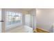 Bright bathroom featuring tile floor, shower with glass door, and window over a tub at 921 Dunagan Way, Lawrenceville, GA 30045