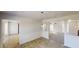 Open concept dining area featuring a pendant light and views to the kitchen and living areas at 921 Dunagan Way, Lawrenceville, GA 30045