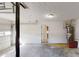 Open garage space with room for storage and parking, showcasing utility connections at 921 Dunagan Way, Lawrenceville, GA 30045