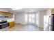 Bright kitchen featuring tile floor, stainless steel appliances, and wooden cabinets at 921 Dunagan Way, Lawrenceville, GA 30045