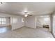 Open-concept living space with living, dining areas, and staircase access to upper level at 921 Dunagan Way, Lawrenceville, GA 30045